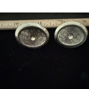 pair of vintage silver tone oval cufflinks with radial textured center